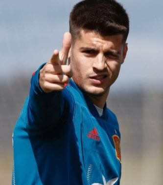 Susana Martin Ramos son Alvaro Morata during the game.